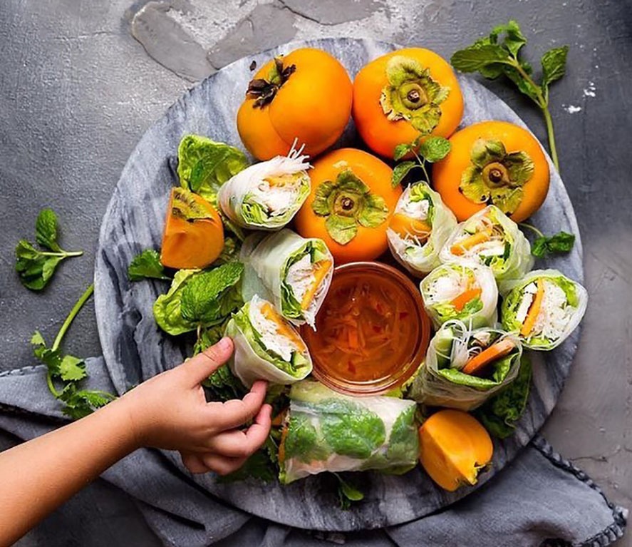 Try adding persimmon to rice paper rolls dipped in sour and salty sauce