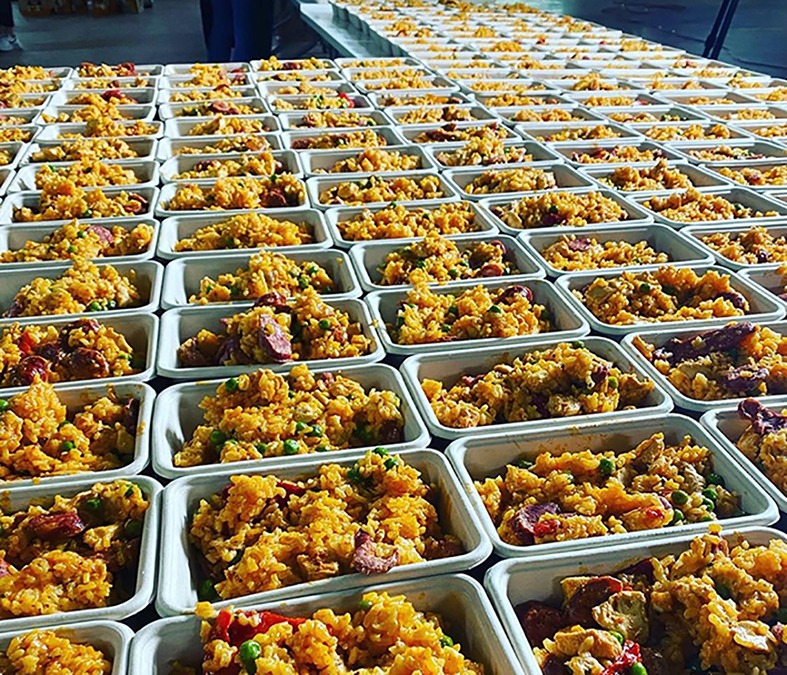 Celebrity chef Miguel Maestre cooks up almost 1000 paellas for those affected by floods